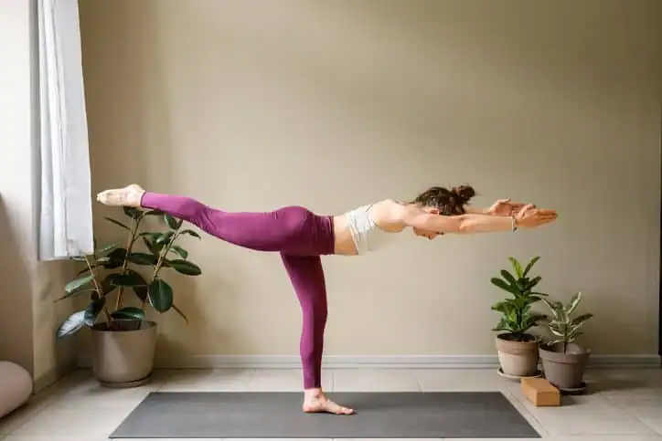 Achieving the Perfect Tone: How Often Should You Exercise for Results? 1 Woman doing Yoga exercise Luton to help with toning the body.
