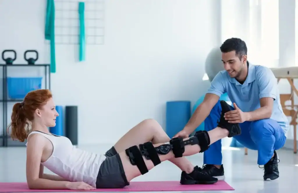 Woman having treatment to help muscle recovery Luton after an injury