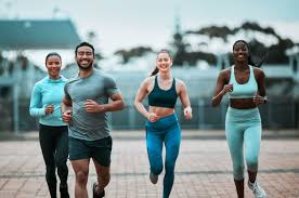 Sculpting Sleek Arms: The Essential Role of Cardio in Toning Without Bulking Up 3 image of people running to incorporate cardio Luton exercise into their life to help tone arms and body.