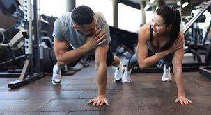 Sculpting Sleek Arms: The Essential Role of Cardio in Toning Without Bulking Up 1 Image of man and woman doing Cardio Luton to tone their arms.